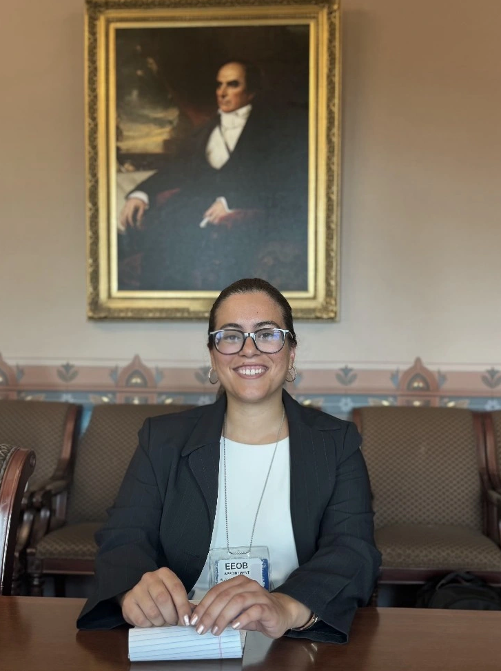 Melissa Lopez-Barbosa sits at a desk in Washington, DC