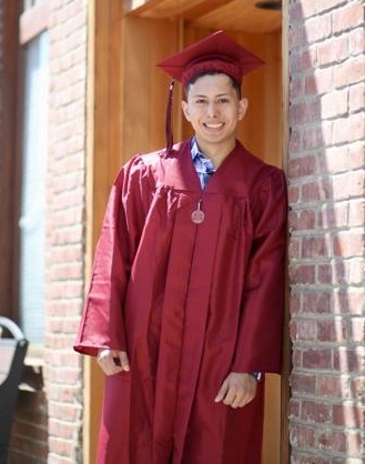 Miguel Gomez in a graduation outfit