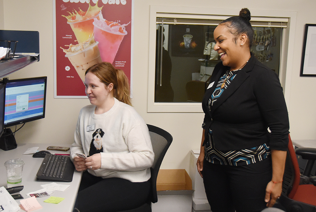 Monique Gonzales shares a laugh with student employee Samantha Griffith.