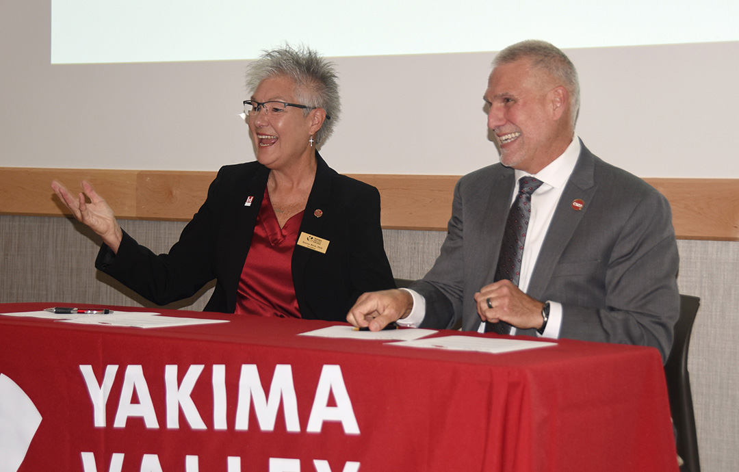 YVC President Teresa Rich and CWU President Jim Wohlpart celebrate their MOU signing on May 26