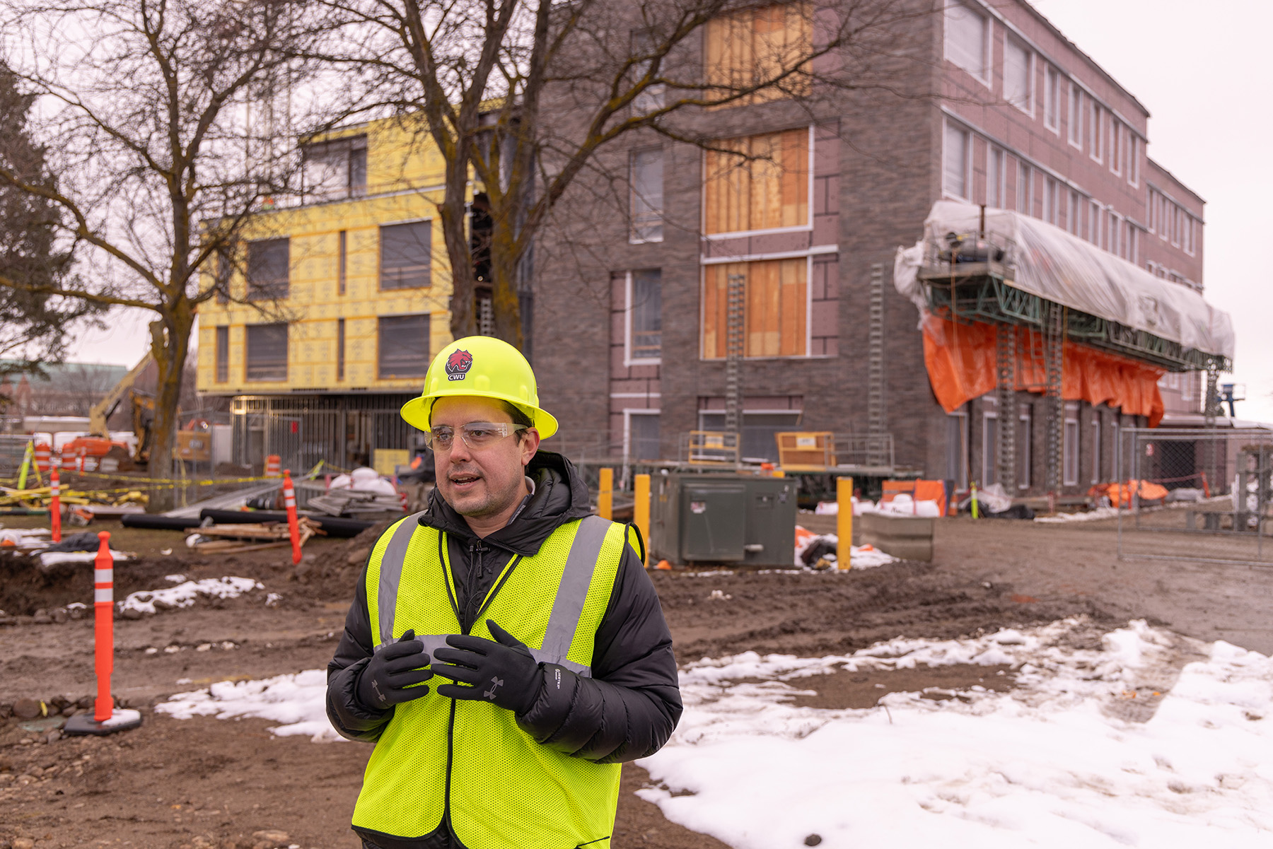 Sustainability Officer Jeff Bousson stands outside the NAC building