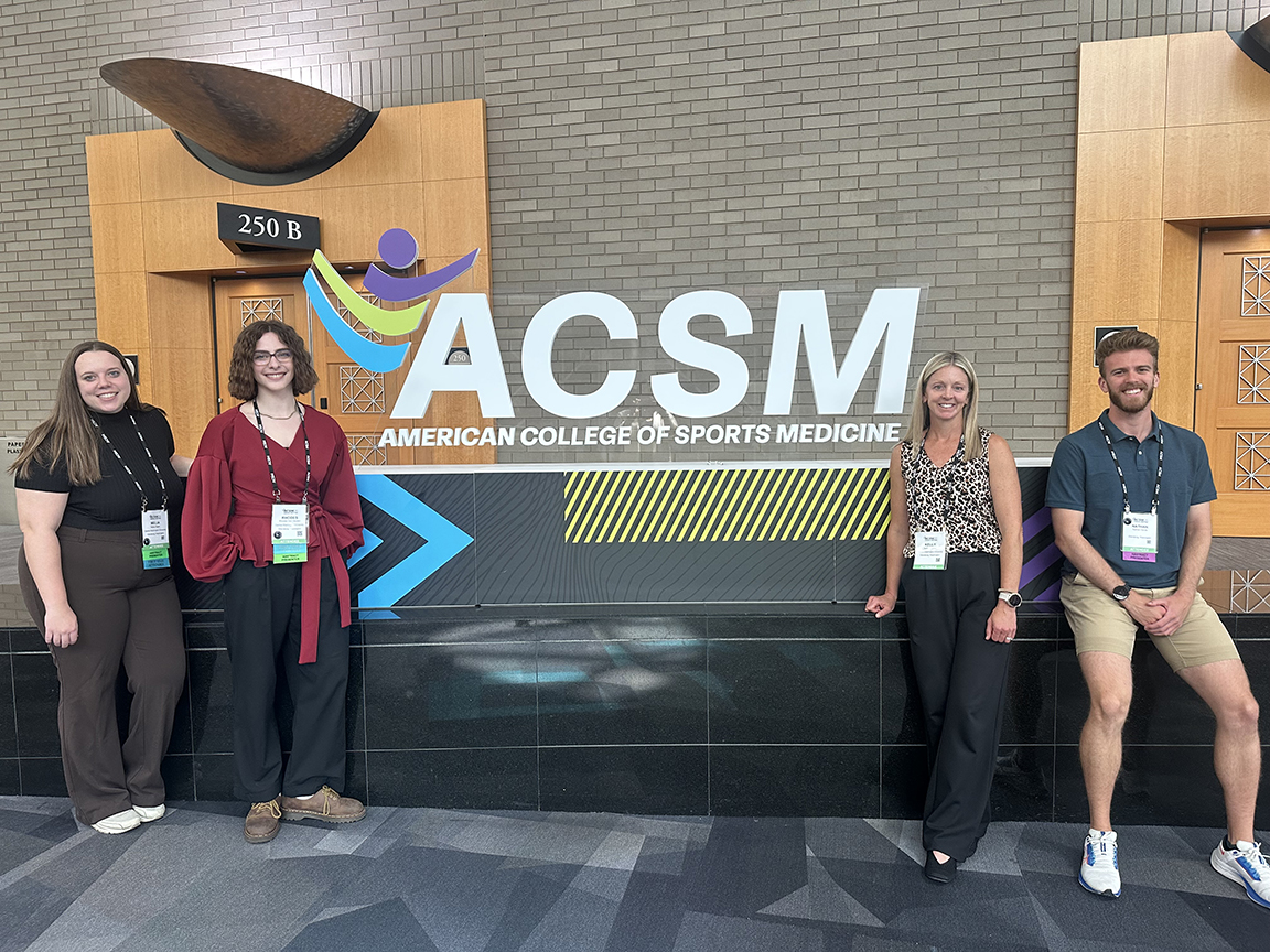 Nathan Herde is joined by Professor Kelly Pritchett and two others at the ACSM national conference in May.