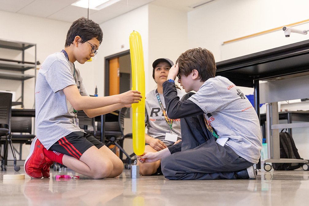 Visiting students work on a project at the June event at CWU