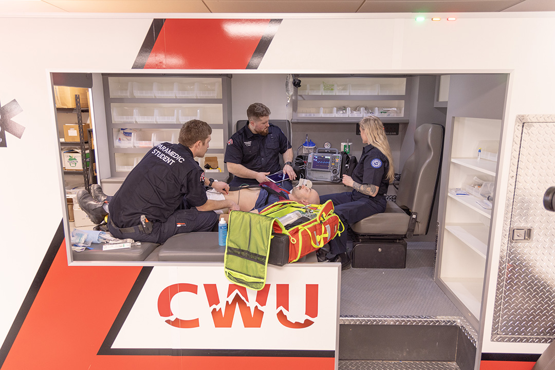 Students train inside the replica ambulance inside the Health Sciences building