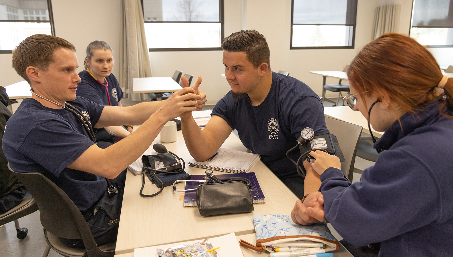CWU paramedicine students at a table