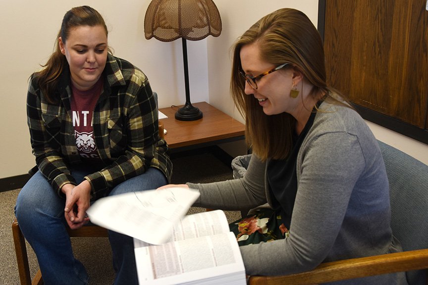 Assistant Professor Olivia Holter, right, meets with CWU School Psychology graduate student Kali Davis.
