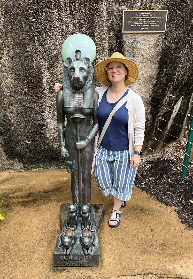 Rachel Kirk stands with an Egyptian statue (Photo by Lydia Melton)