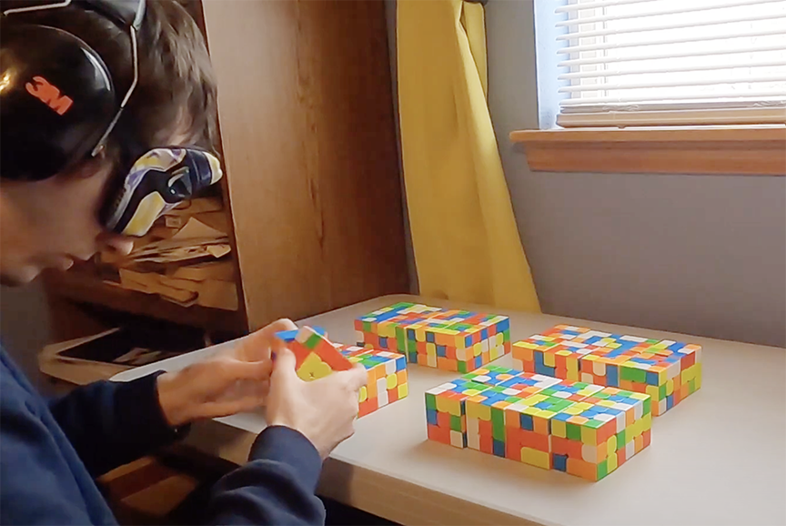 CWU student Ethan Davis won two events at a February 18-19 competition in Everett, solving 30 out of 37 cubes while blindfolded.