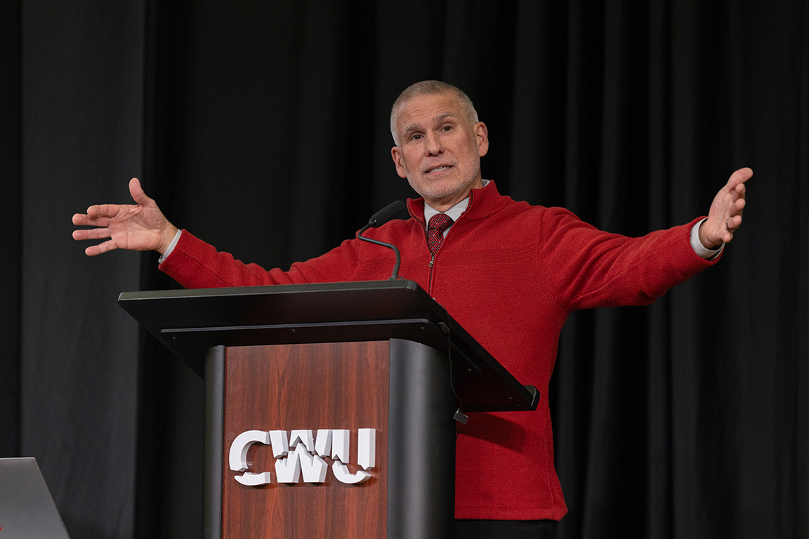 CWU President Jim Wohlpart speaks at the podium