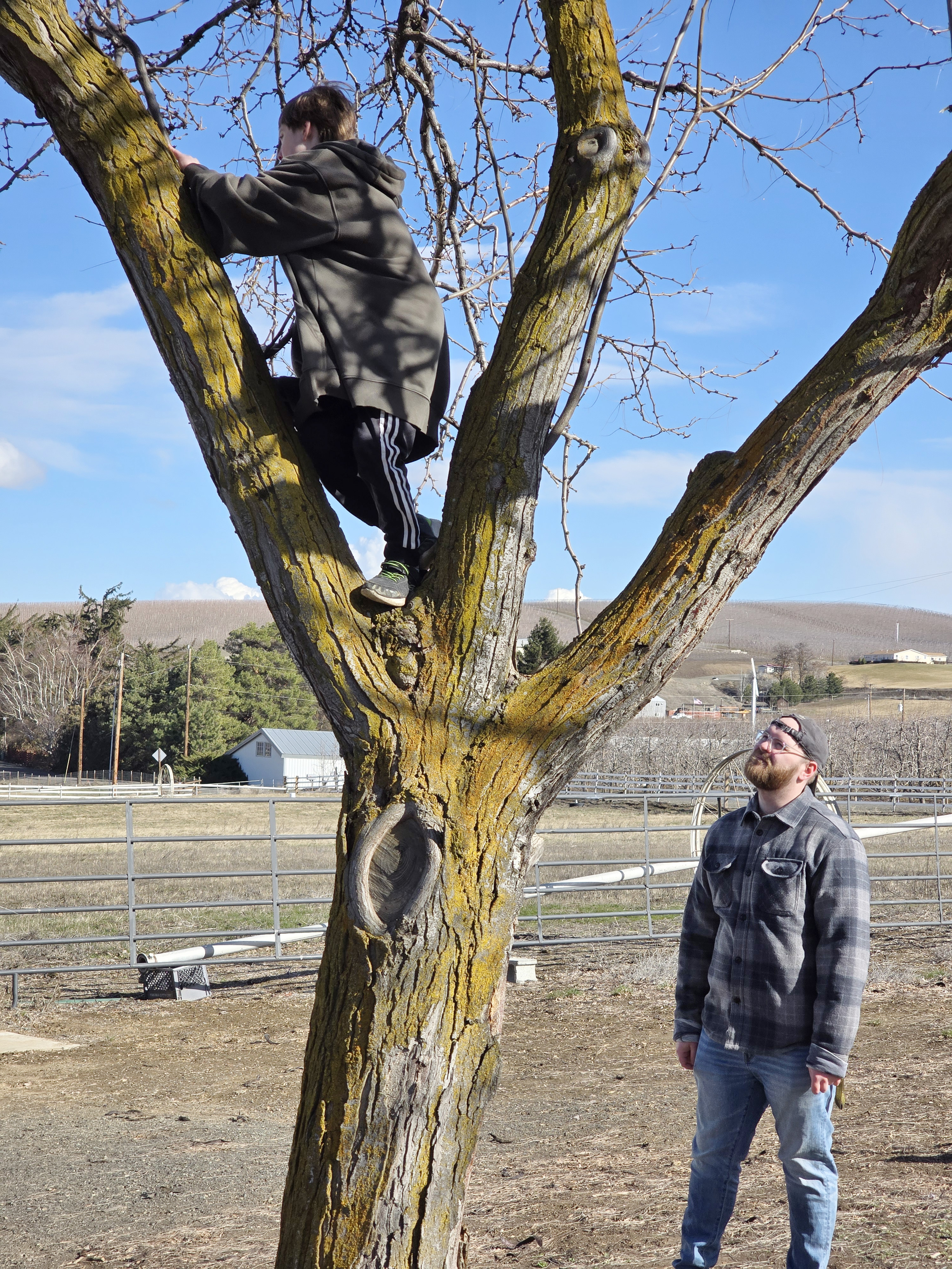 CWU student Ethan Berger works with one of the Lathrop children at their Ellensburg home