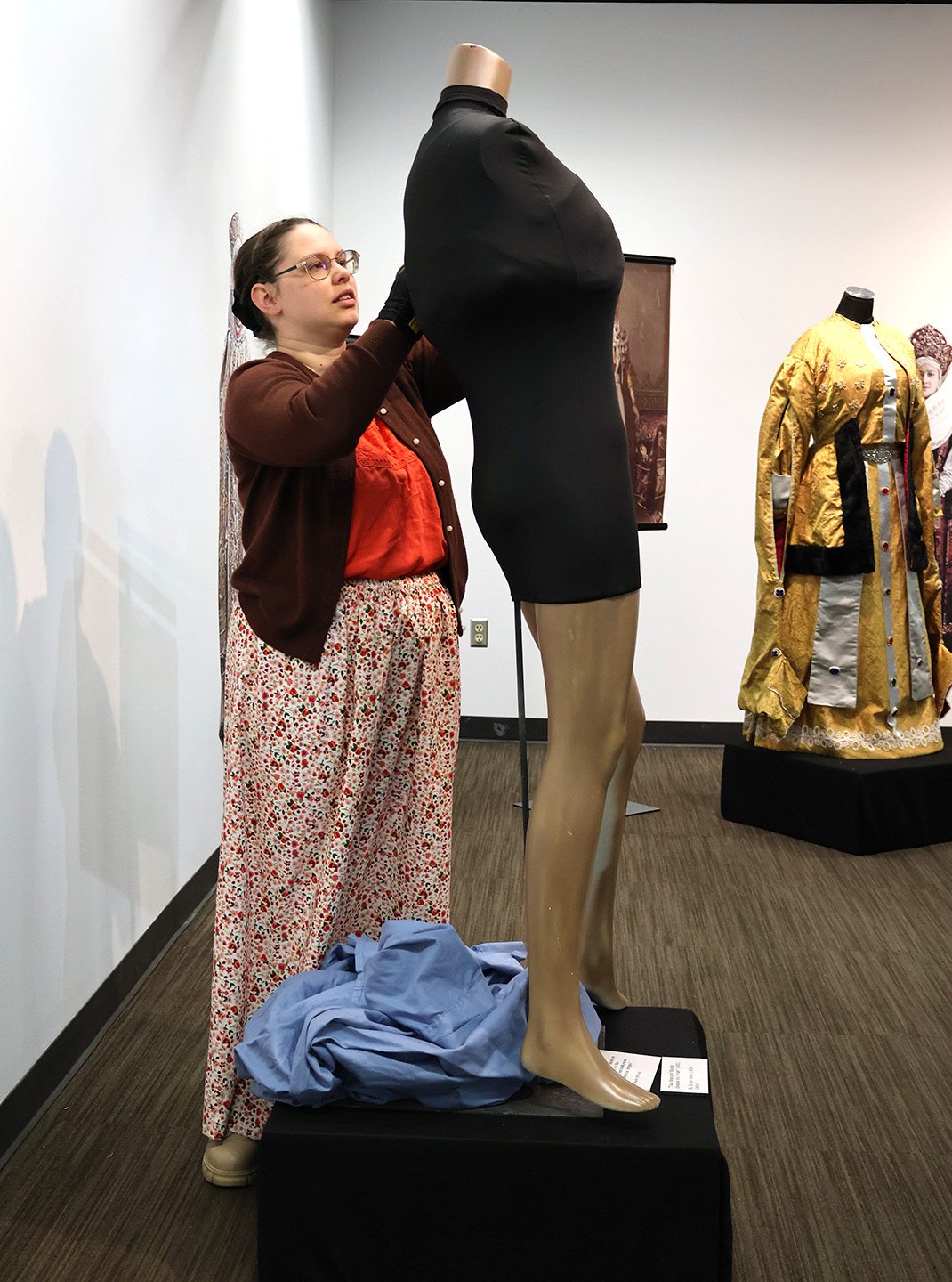 Naomi Whiting prepares the MCE exhibit