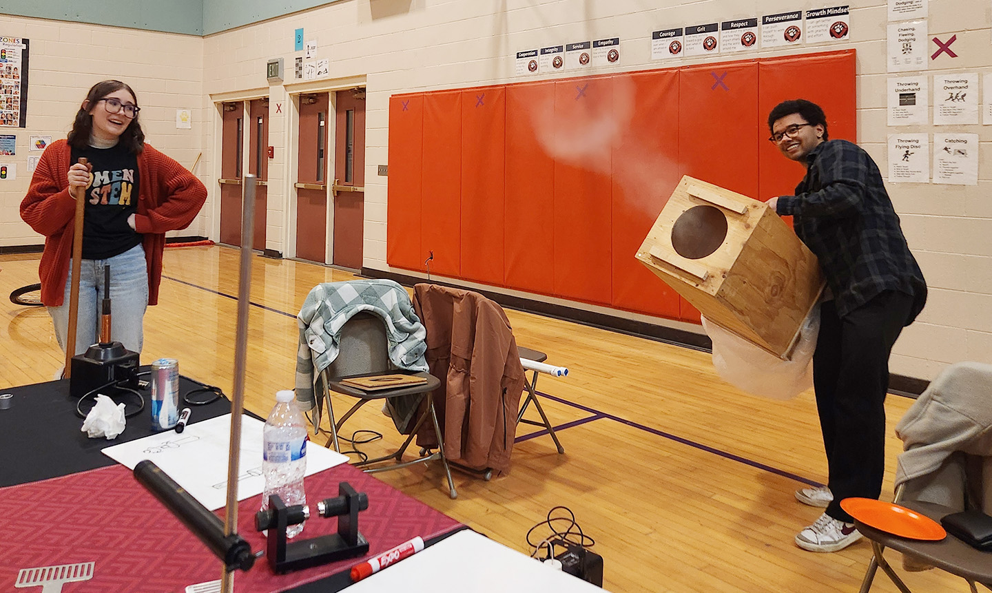 CWU Physics Club members demonstrate how to make smoke rings