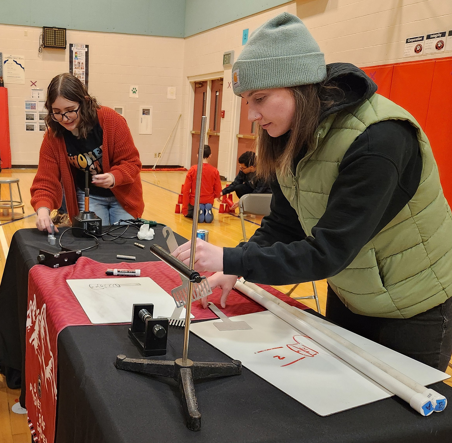 Two Physics Club members do a demonstration