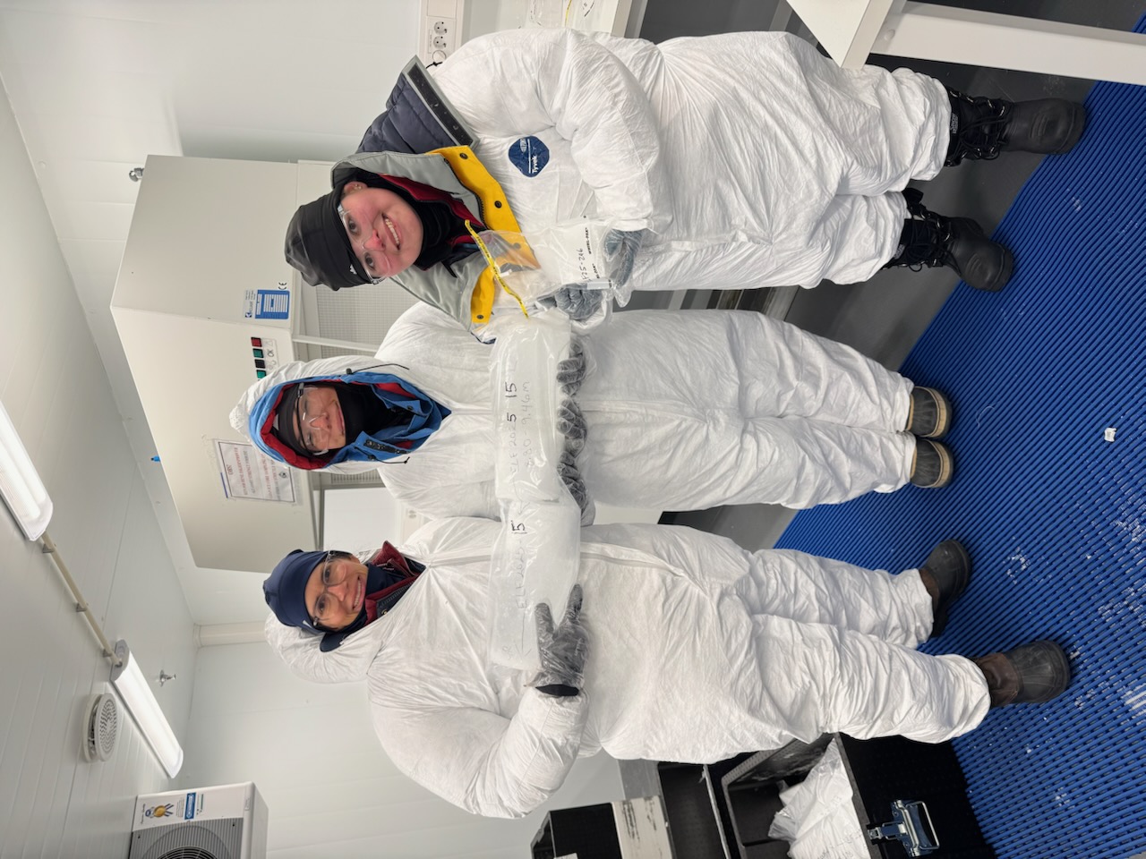 The CWU team holds ice cores inside the Norway lab.