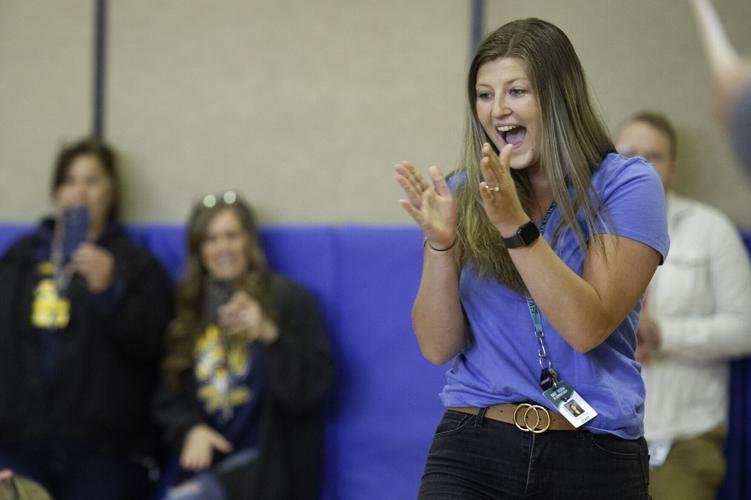 Bay View Elementary School kindergarten teacher Jenna Perry looks to her students after learning at the school Wednesday she had won the Outstanding Young Educator Award.