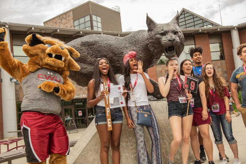 Students in front of the Wildcat statue