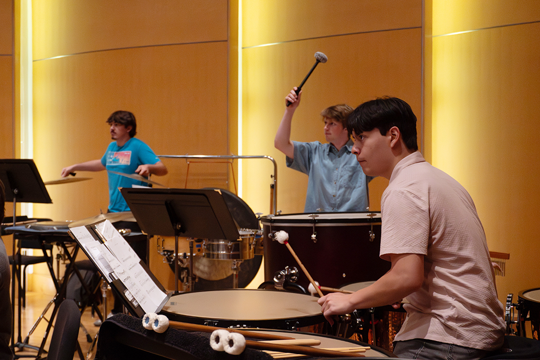 CWU Wind Ensemble percussionists on stage.