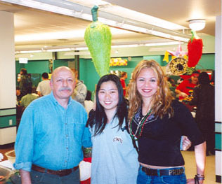 A student and their parents at the mall.