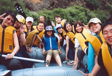 ESL Students in a rafting boat.