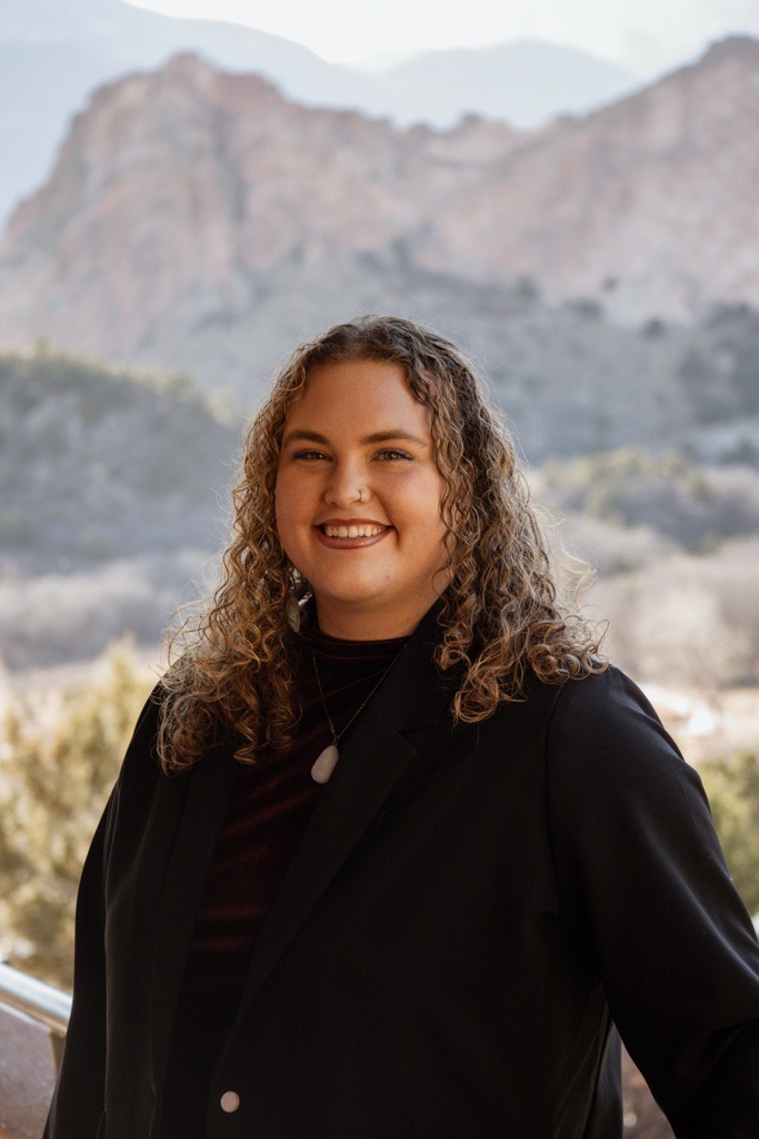 Jordan Headshot with mountain background