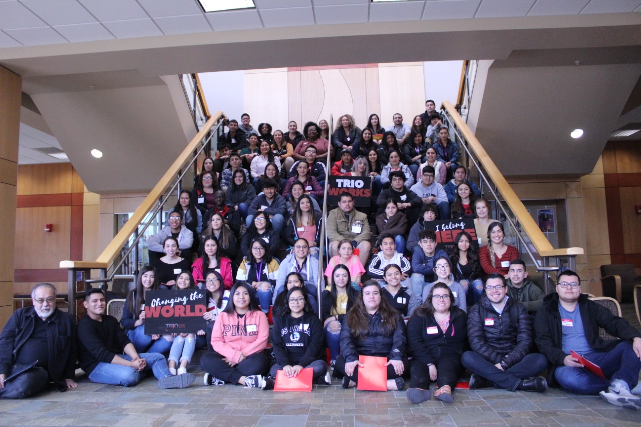 Group of CWU students and faculty sitting on a stair case
