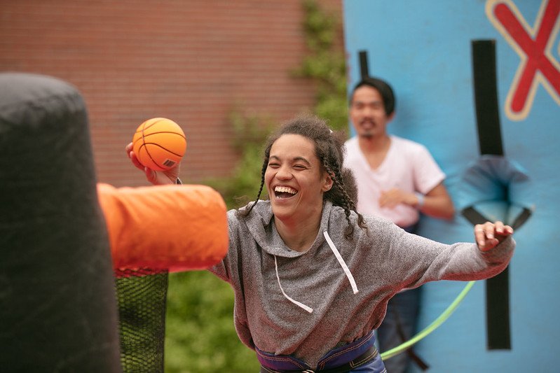 student participating in a game outside.