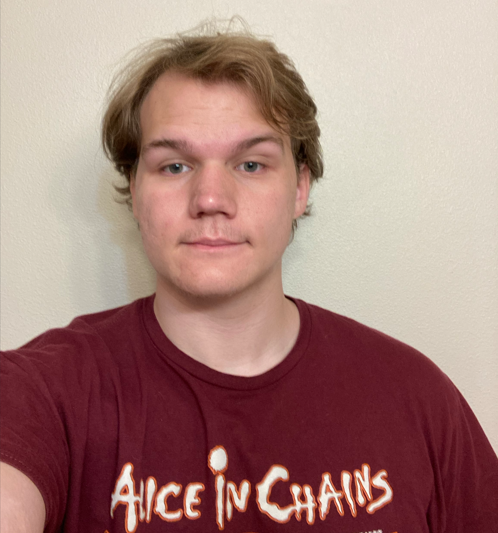 Picture of accounting business tutor in a red shirt.
