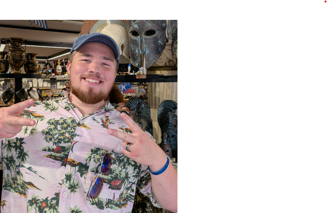 Computer science tutor in a Hawaiian shirt holding a peace sign