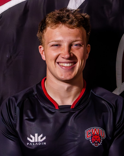 psychology tutor in a black rugby shirt