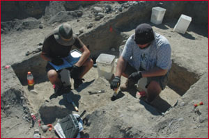 Students Mark Steinkraus and Lorin Davidson excavating Unit 9