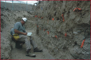 Dr. Karl Lillquist mapping stratigraphy in trench