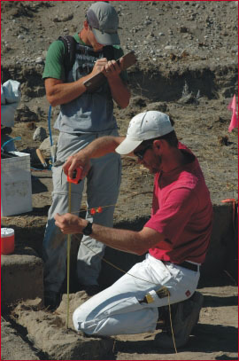 Student Miles Muscato and Dr. Patrick Lubinski measuring depths
