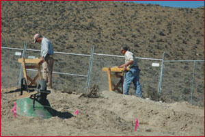 Screening excavated sediment through 1/8" hardware cloth