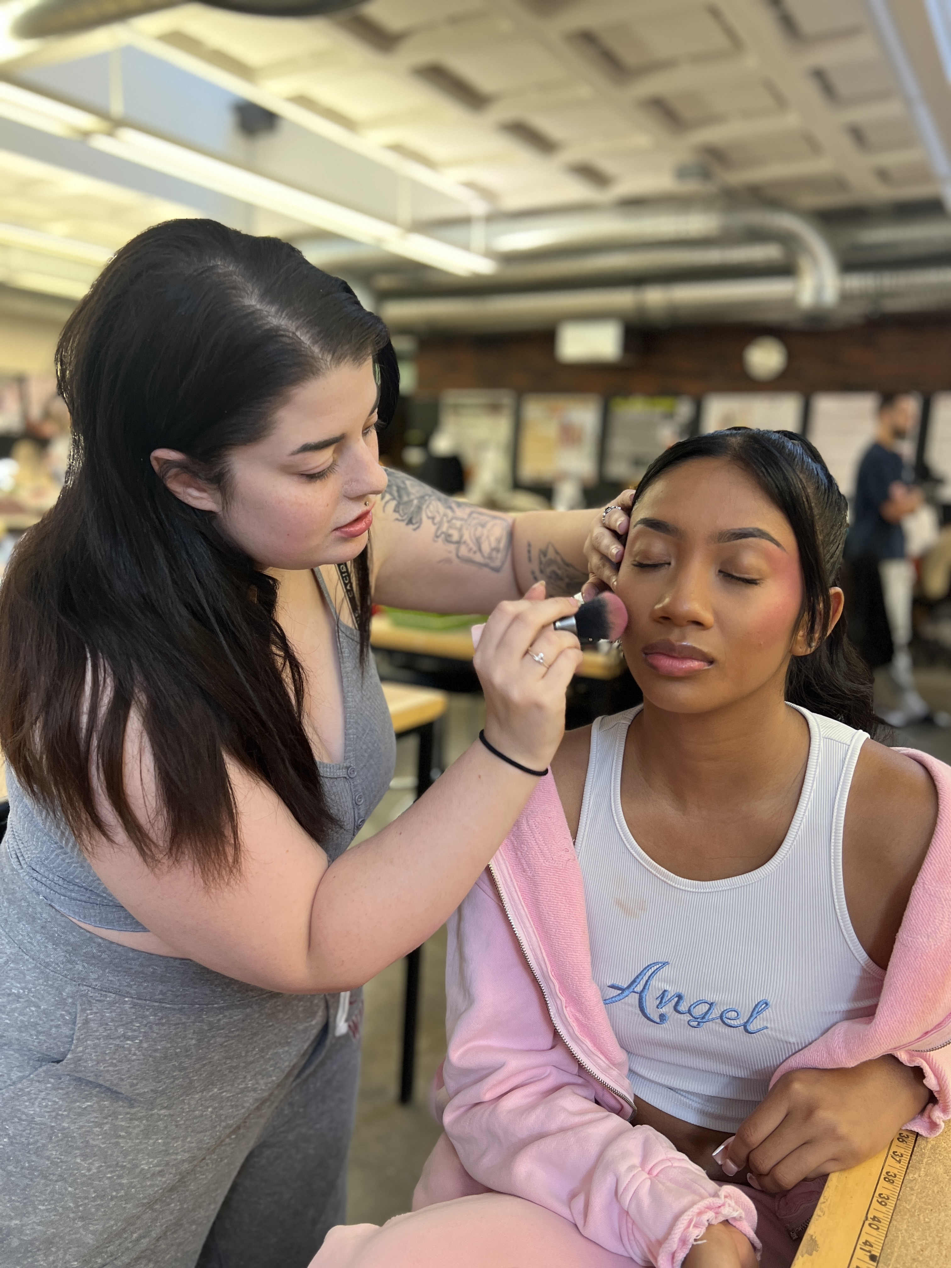 Model getting makeup done