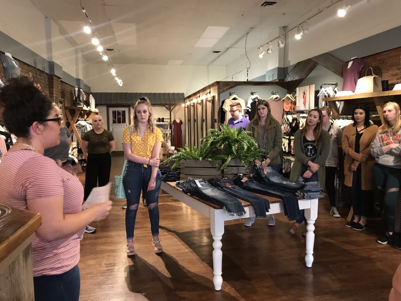 Students touring Claim Clothing