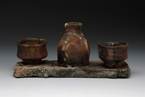 three ceramic bowls on a ceramic tray