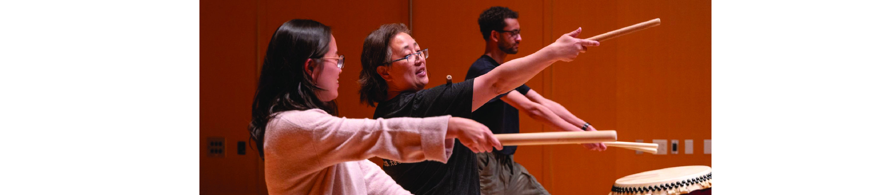 Professor Eun Young Lee playing taiko drums.