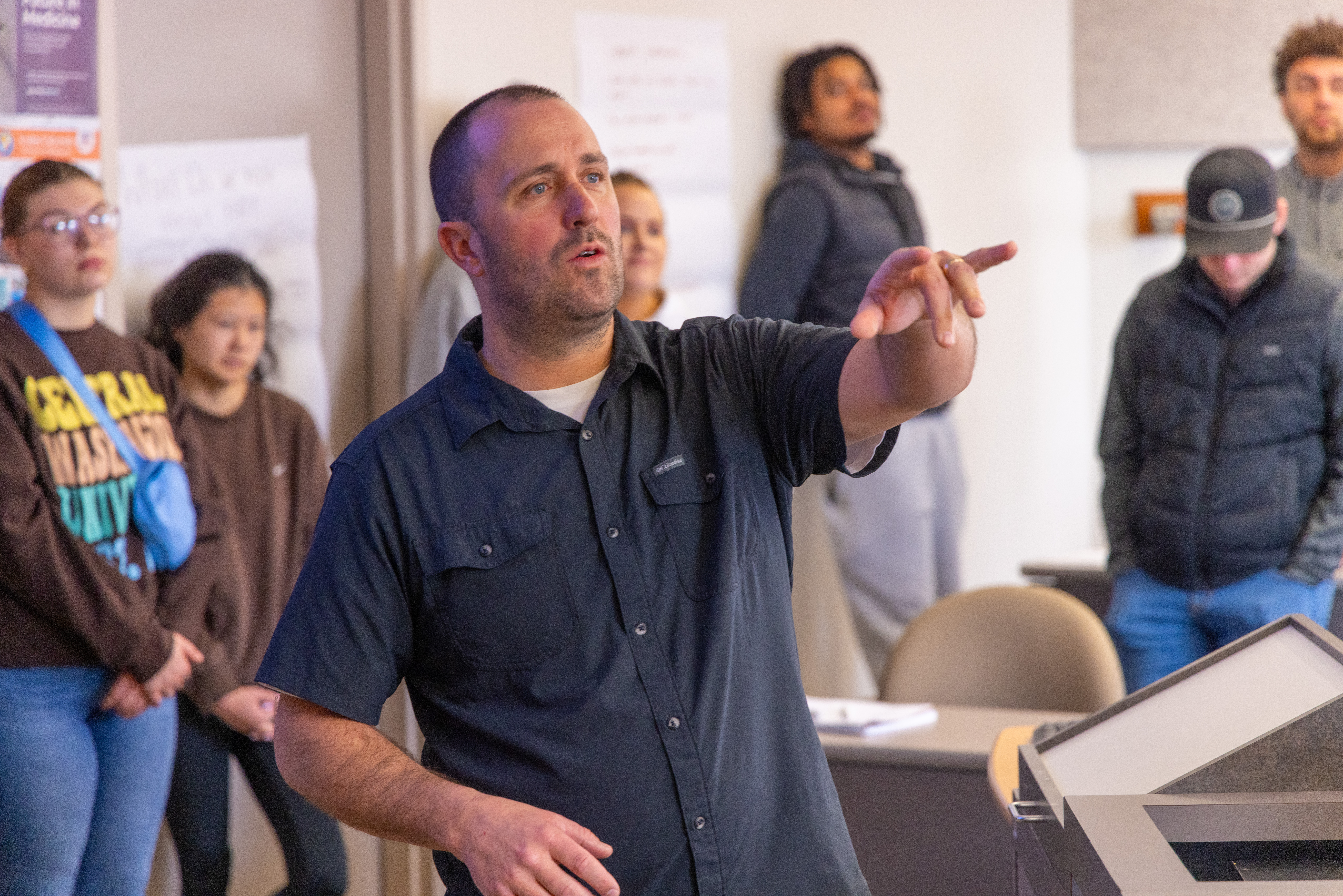 Student leading a lecture during class. 