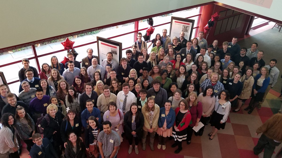 Overhead view of a large group of CWU students attending a play.