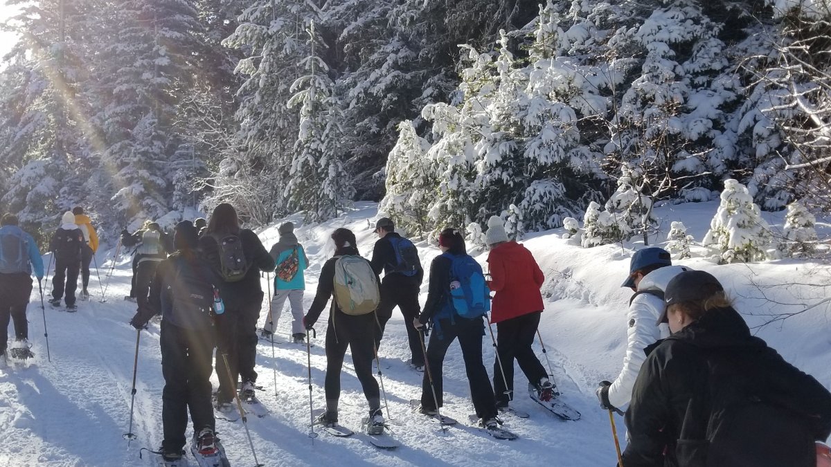 CWU Students outside snowshoeing.