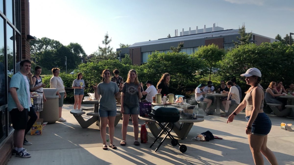 CWU DHC students standing around posing during their barbeque end of year celebration.