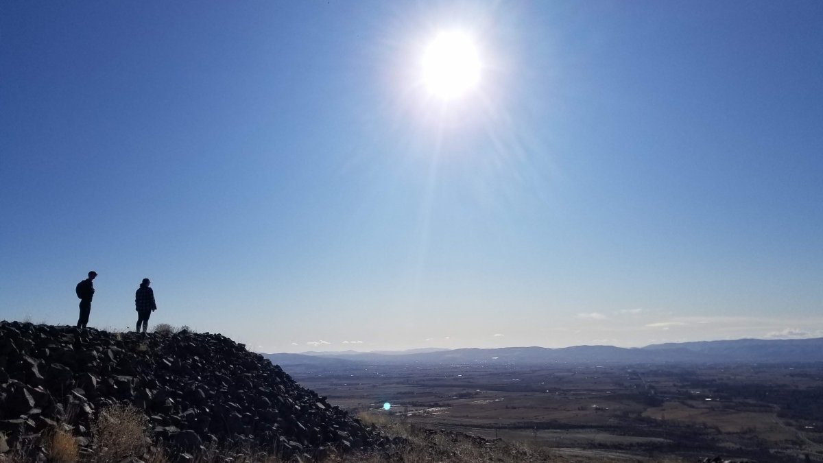 Two CWU students gazing out at Naneum creek view.