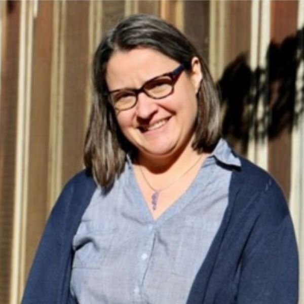 Allyson Rogan-Klyve smiling in the sun.