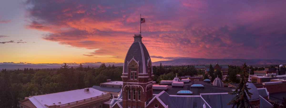 CWU's Barge Hall at sunrise, some clouds in the sky