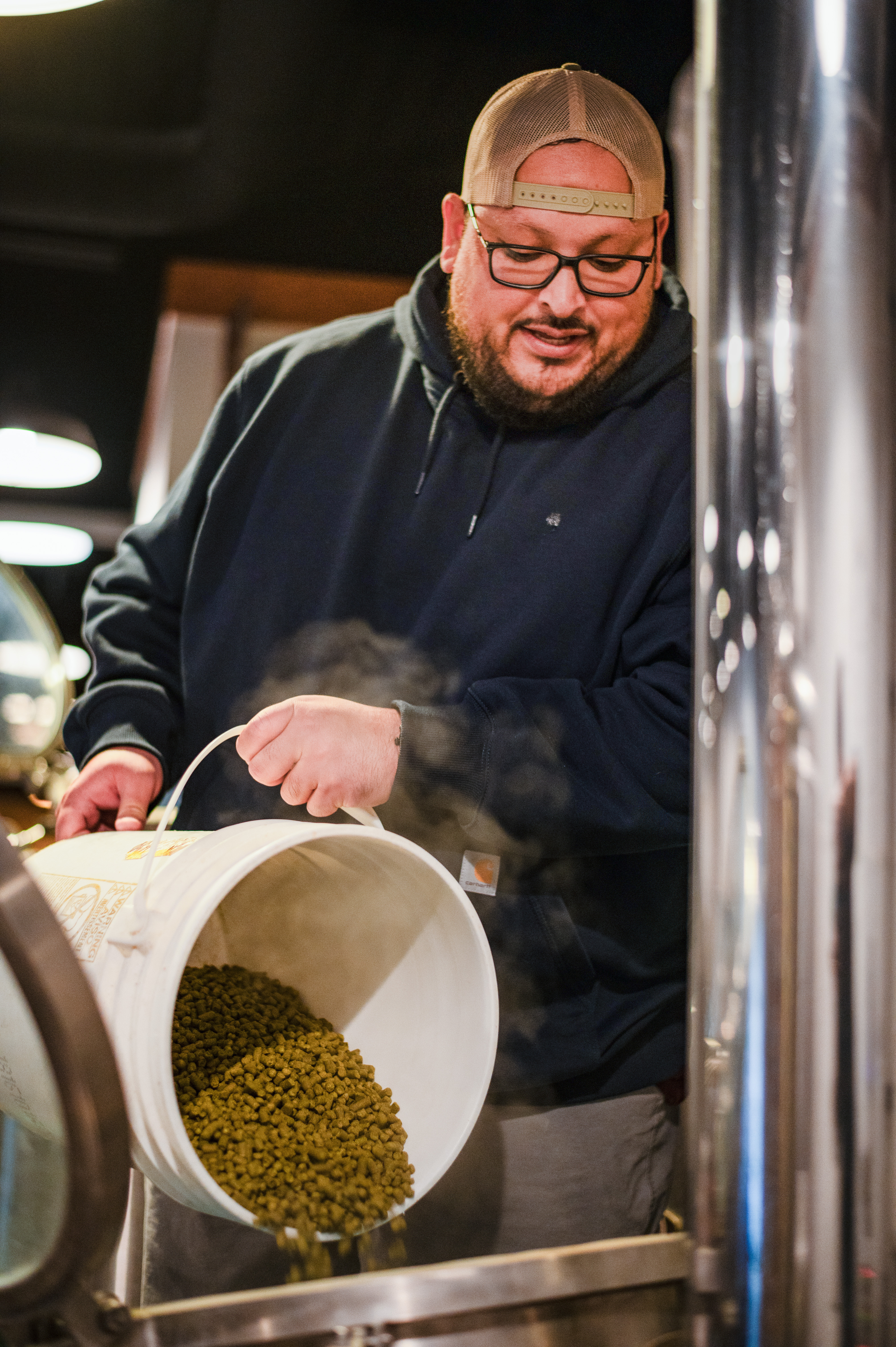 Ruben pouring grain from bucket