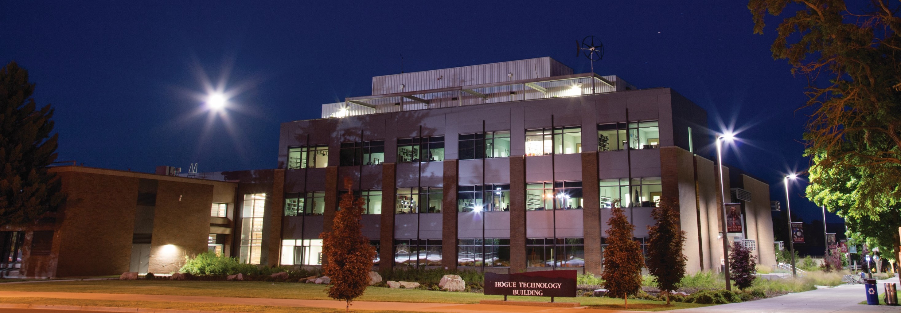 A picture of the Hogue Technology Building at night.