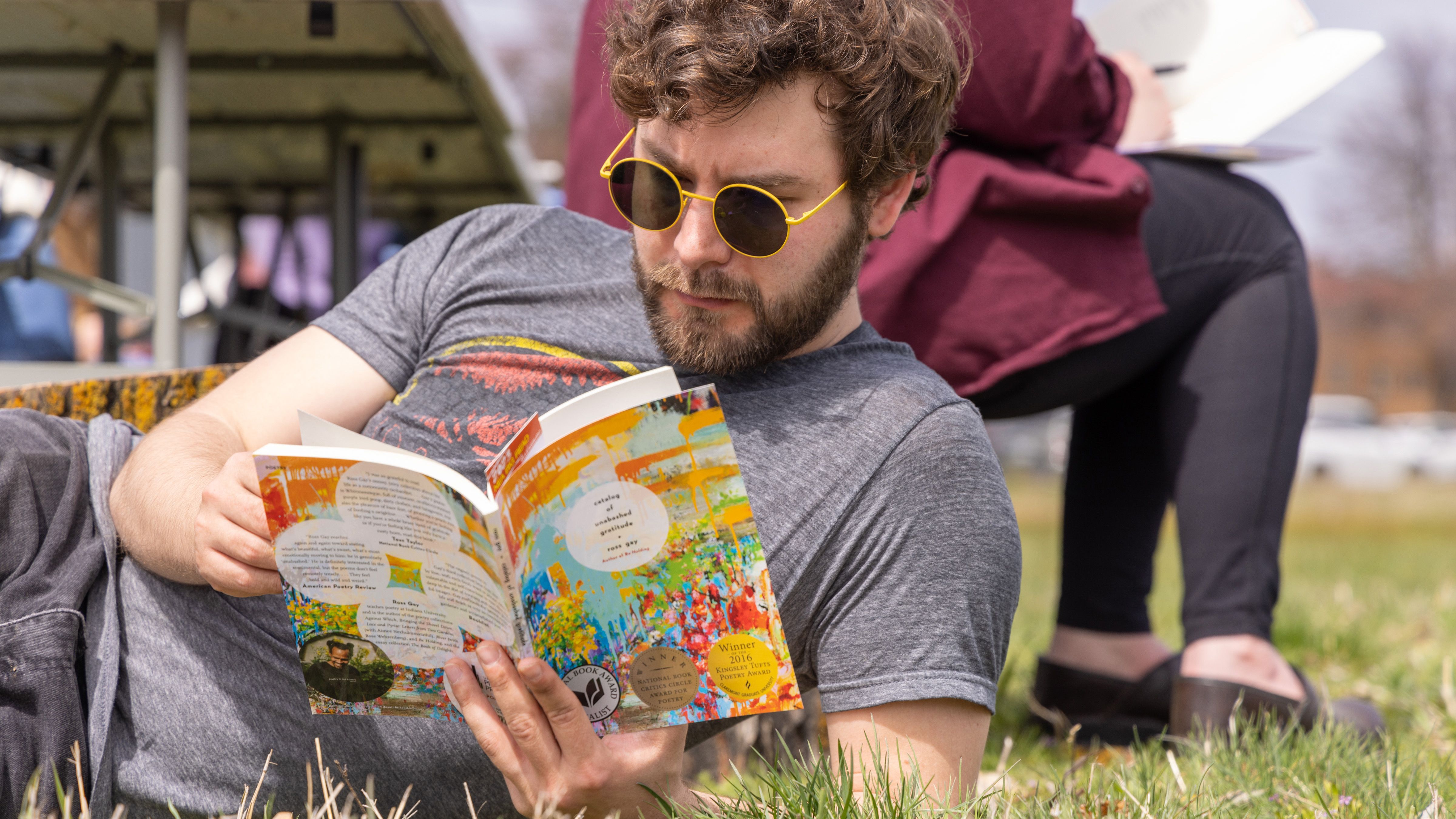Man reading on lawn at CWU