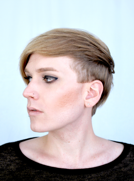Jos Charles photo by Cybele Knowles of Jos's head turned to the right showing up her cheekbones and deeply parted pixie cut hair