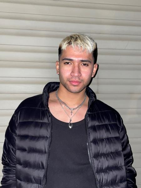 Portrait of Michael Puni wearing a black puffer jacket