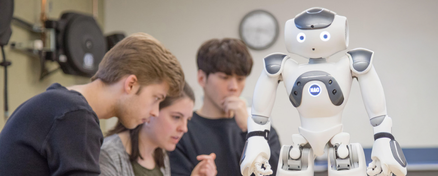 Students working on programming a robot